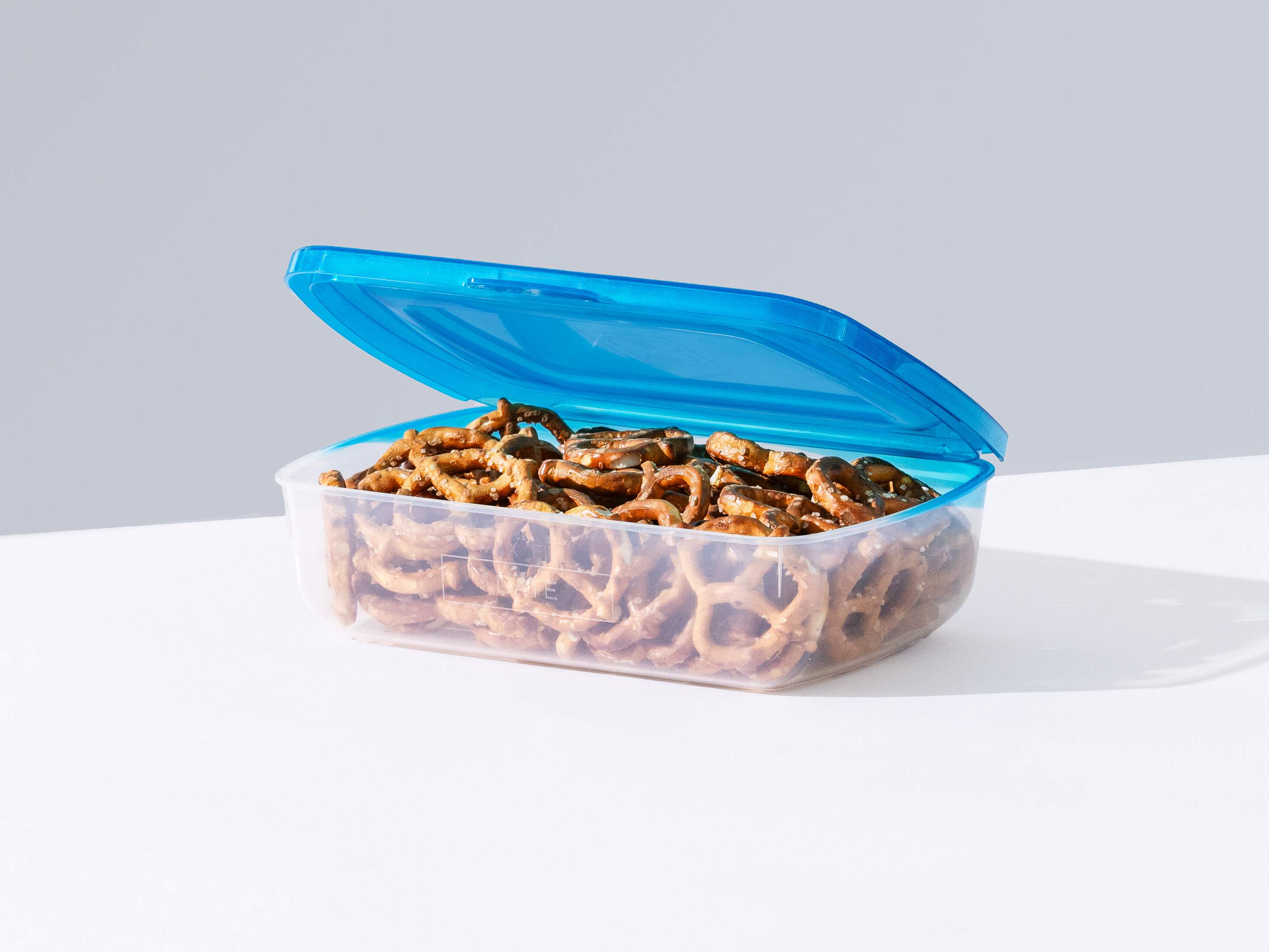 Mr. Lid - The Lid's attached!  Plastic Food Storage Container!